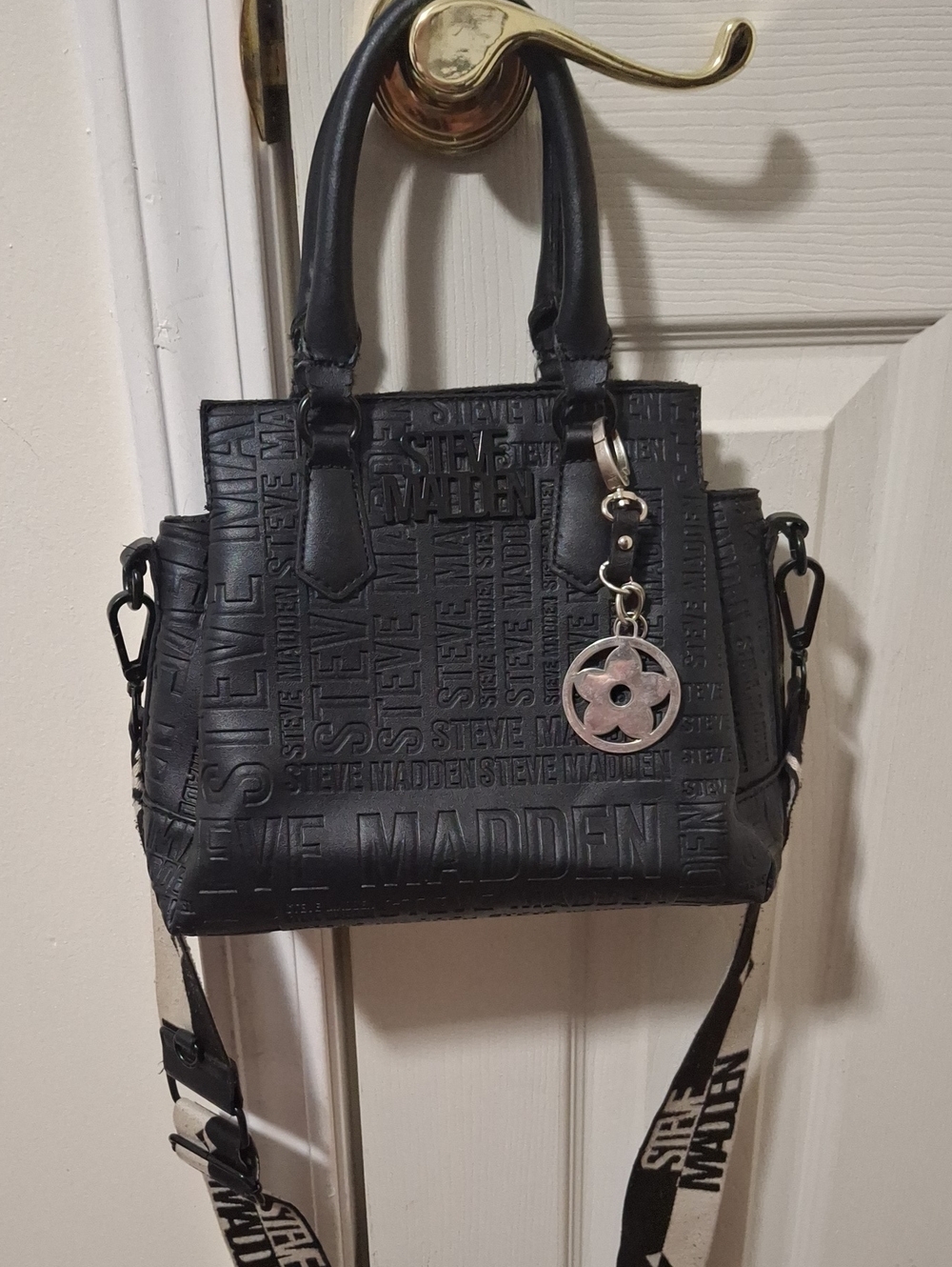 Steve Madden Black Embossed Logo Crossbody Satchel with Branded Guitar Strap - Picture 1 of 14